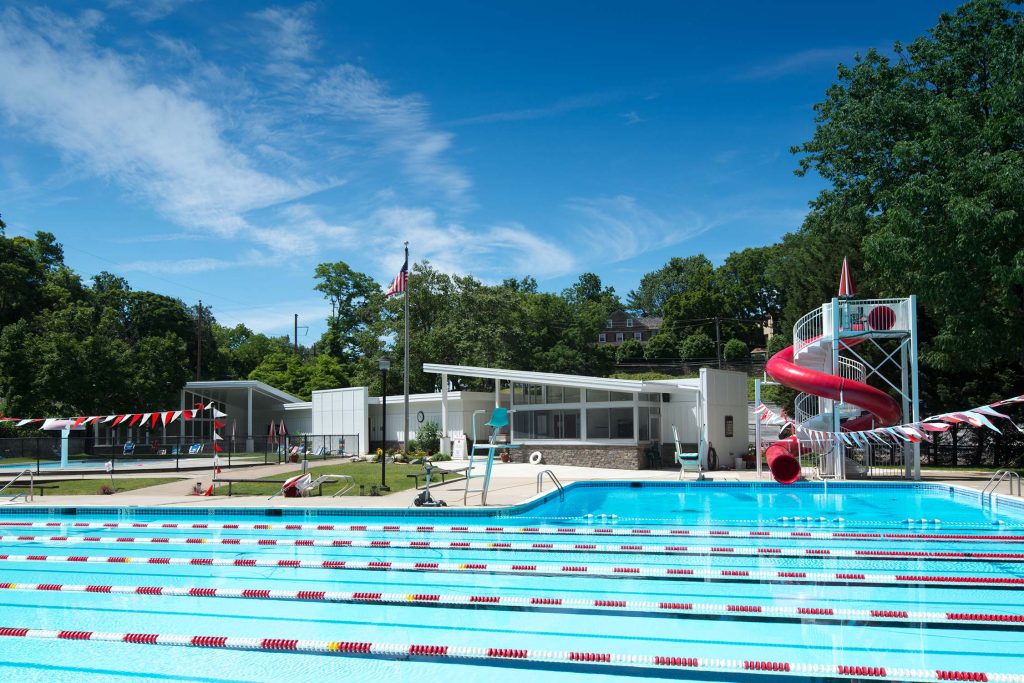 Karakung Swim Club in Ardmore, PA, with a pool, red slide, and clubhouse.