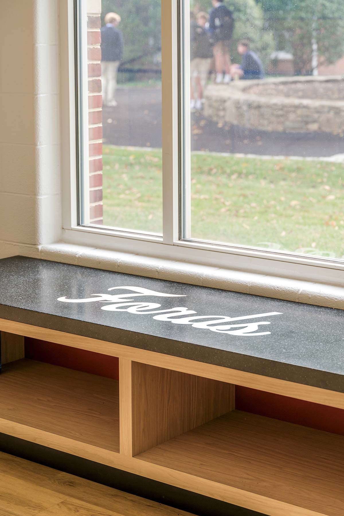 Wooden bench with a granite top labeled